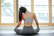Head tilts can ease neck pain. (Photo via Pexels/Miriam Alonso)